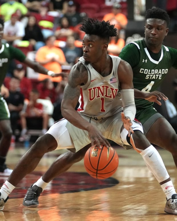 Feb 19, 2022; Las Vegas, Nevada, USA; UNLV Runnin' Rebels guard Michael Nuga (1) dribbles against Colorado State Rams guard Isaiah Stevens (4) during the second half at Thomas &amp; Mack Center. Mandatory Credit: Stephen R. Sylvanie-USA TODAY Sports
